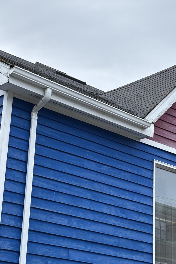Gutter and downspout at Pier One after cleaning, clear and white