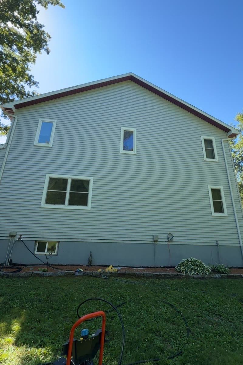 The same siding after a Titan soft wash, clean and bright
